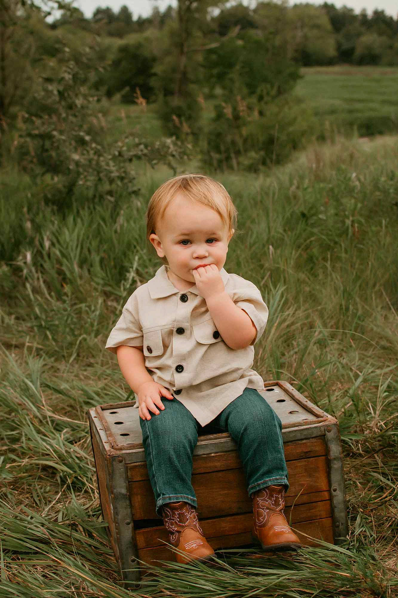 Rease joined the competition — help win amazing prizes! baby, baby_toddler_clothing, blond, child, fun, grass, grassland, hair, happy, landscape, people_in_nature, person, plant, prairie, sitting, sky, soil, toddler, toy, tree