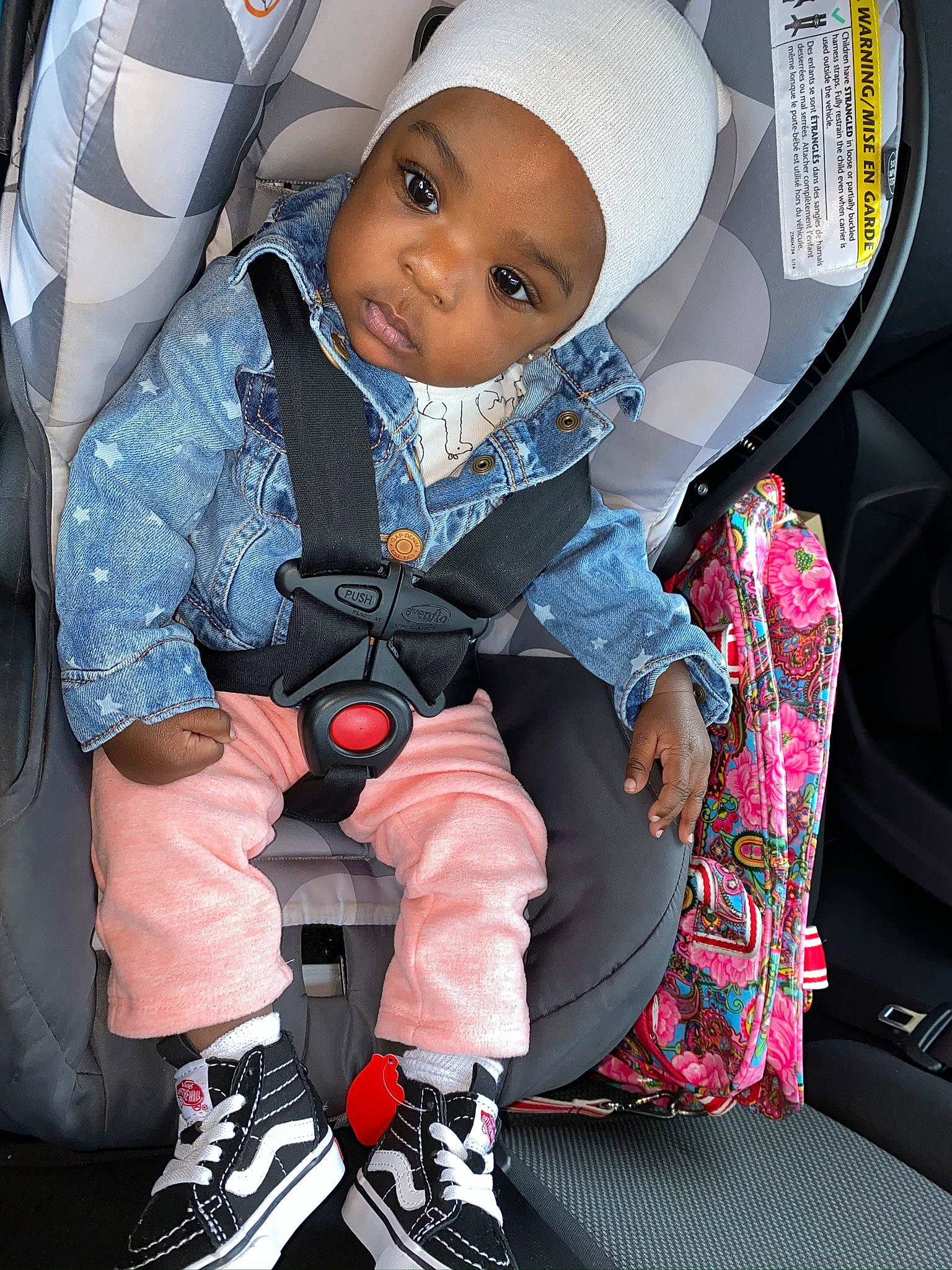 Devyn is registered to the contest to win money with this photo: auto_part, baby, baby_carriage, baby_in_car_seat, baby_products, car, car_seat, car_seat_cover, child, headwear, person, pink, product, seat_belt, toddler
