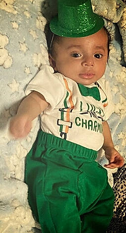 Ezekial joined the competition — help win amazing prizes! baby, baby_products, baby_toddler_clothing, cap, child, cool, costume_hat, fashion_accessory, fun, gesture, green, happy, headwear, jersey, pattern, person, personal_protective_equipment, skin, sleeve, t_shirt