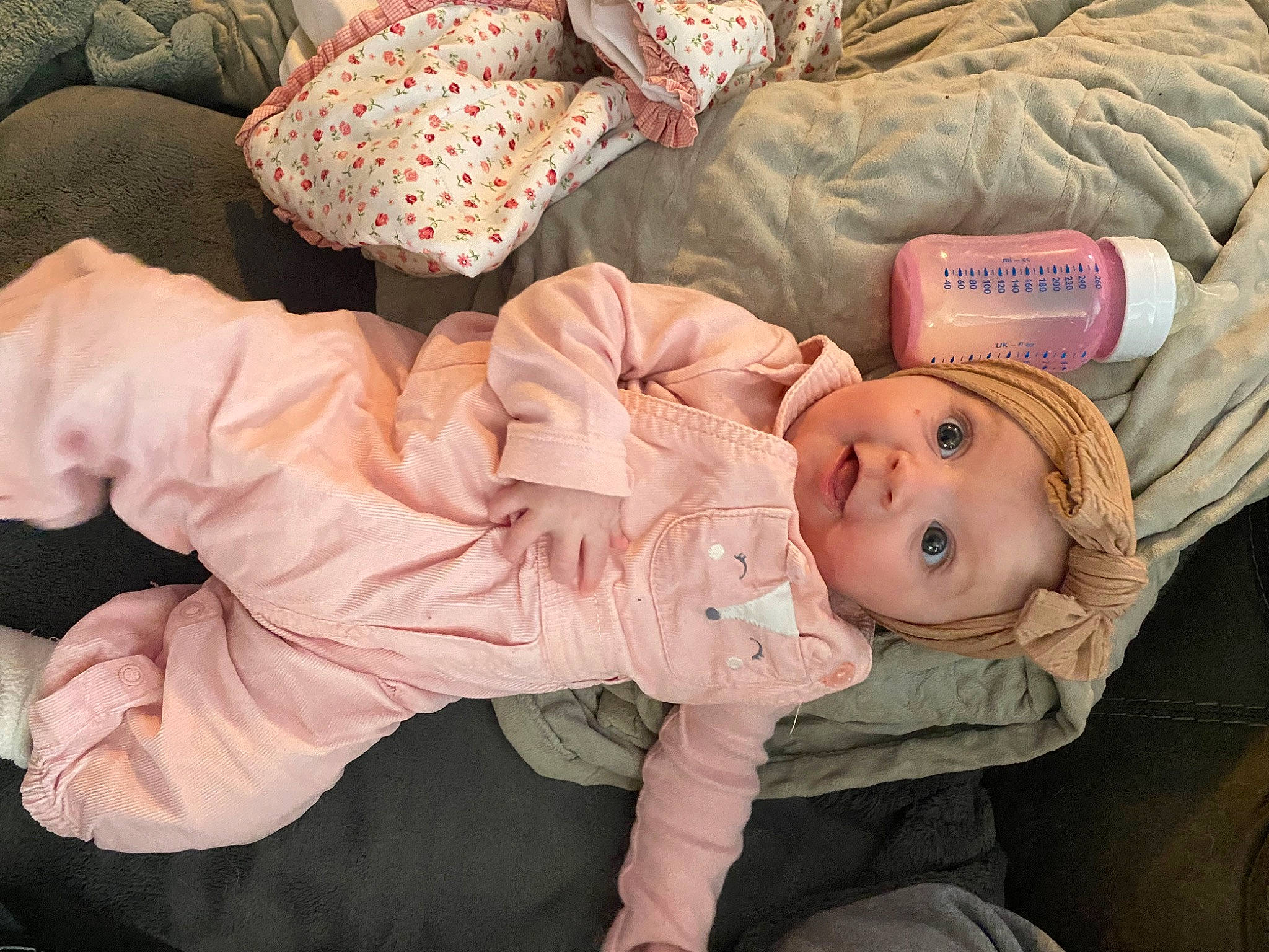 Ivie is registered to the contest to win money with this photo: baby, baby_products, baby_sleeping, baby_toddler_clothing, bedding, bedtime, cheek, child, comfort, hat, headgear, headwear, linens, nap, person, sitting, sleep, sleeve, smile, surprise
