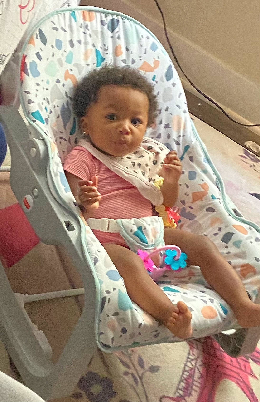 Rose is registered to the contest to win money with this photo: baby, baby_carriage, baby_products, baby_safety, baby_toddler_clothing, car_seat, chair, cheek, child, comfort, eye, fun, linens, mouth, person, room, sitting, skin, toddler, vacation