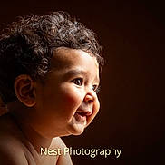 Mohammad is registered to the contest to win money with this photo: baby, child, curly_hair, face, smile, portrait, side_view, soft_lighting, cute, infant, skin, expression, young, happy, profile, closeup, head, innocent, human, background