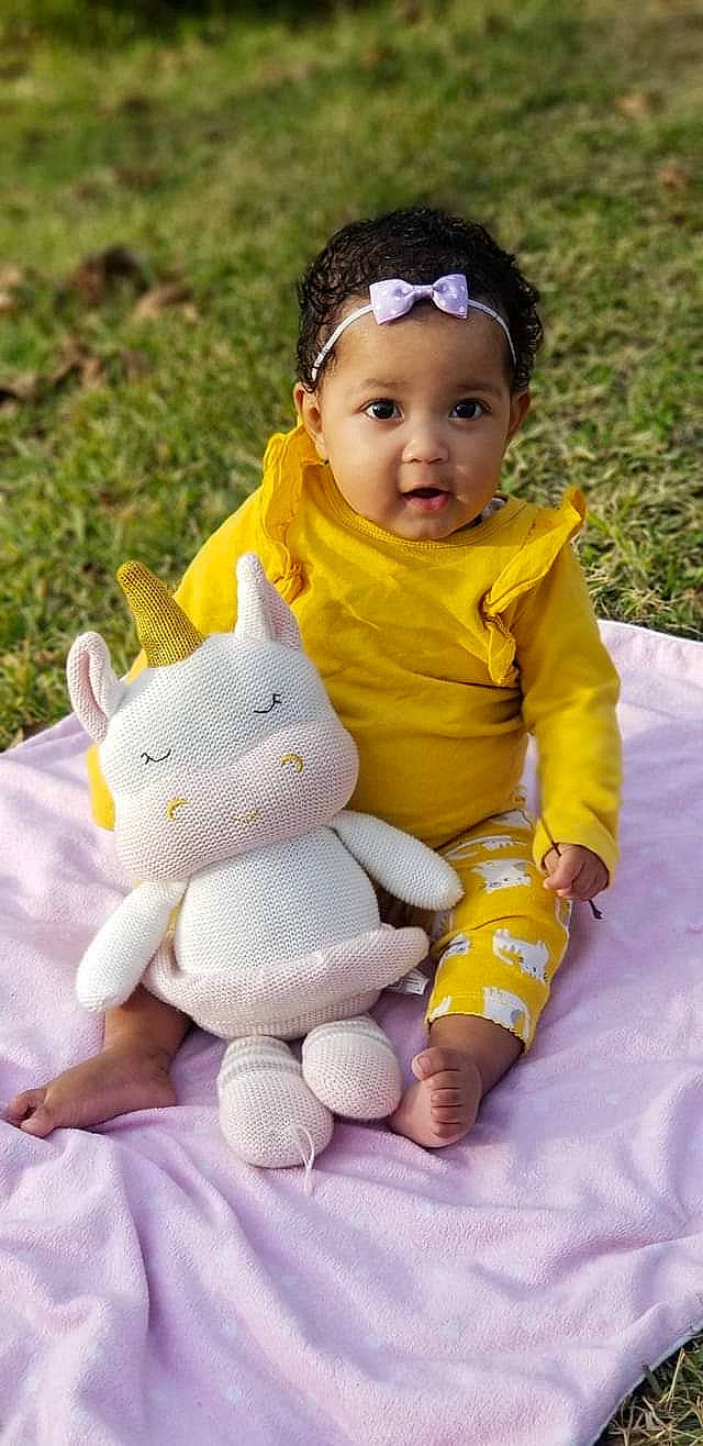 Silvia is registered to the contest to win money with this photo: baby, baby_products, baby_toddler_clothing, child, pattern, person, play, sitting, skin, smile, toddler, toy, yellow