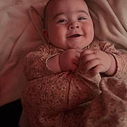 Alayah joined the competition — help win amazing prizes! baby, smiling, blanket, onesie, infant, happy, face, hands, soft, cute, child, cozy, clothing, portrait, lying_down, warm, comfort, young, indoors, person