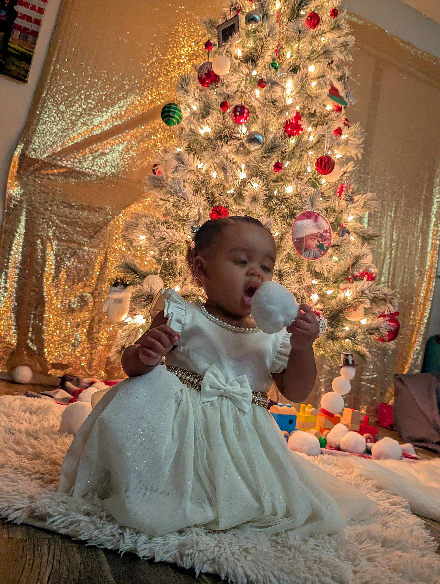 Farah 'Ajante is registered to the contest to win money with this photo: accessories, baby, bodypart, clothing, couch, dress, face, finger, food, formalwear, furniture, hand, head, jewelry, lighting, necklace, person, photography, portrait, sweets