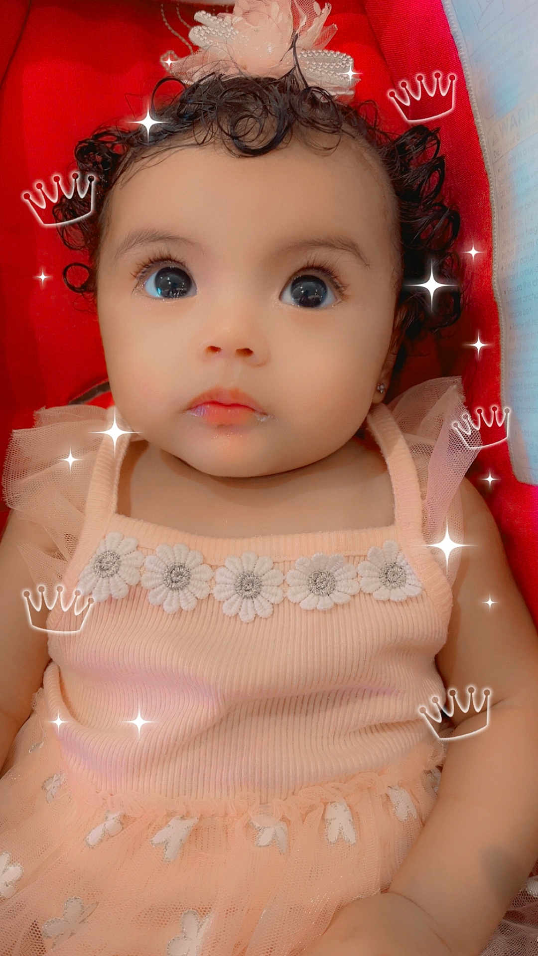 Tzarella is registered to the contest to win money with this photo: adorable, baby, child, closeup, crown, curly_hair, cute, digital_overlay, dress, flower, infant, looking_up, person, pink, portrait, red_background, smileless, soft, sparkle, tulle