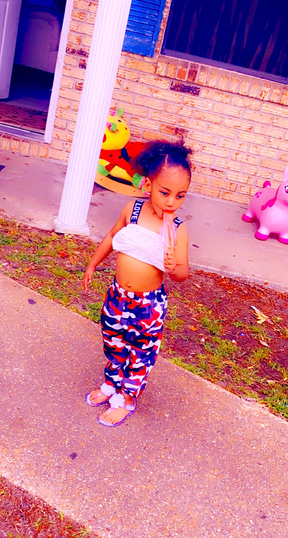 Blessyn is registered to the contest to win money with this photo: baby_toddler_clothing, barefoot, child, electric_blue, foot, fun, happy, human_leg, leisure, magenta, pattern, people_in_nature, person, pink, play, purple, sandal, summer, tints_and_shades, toddler