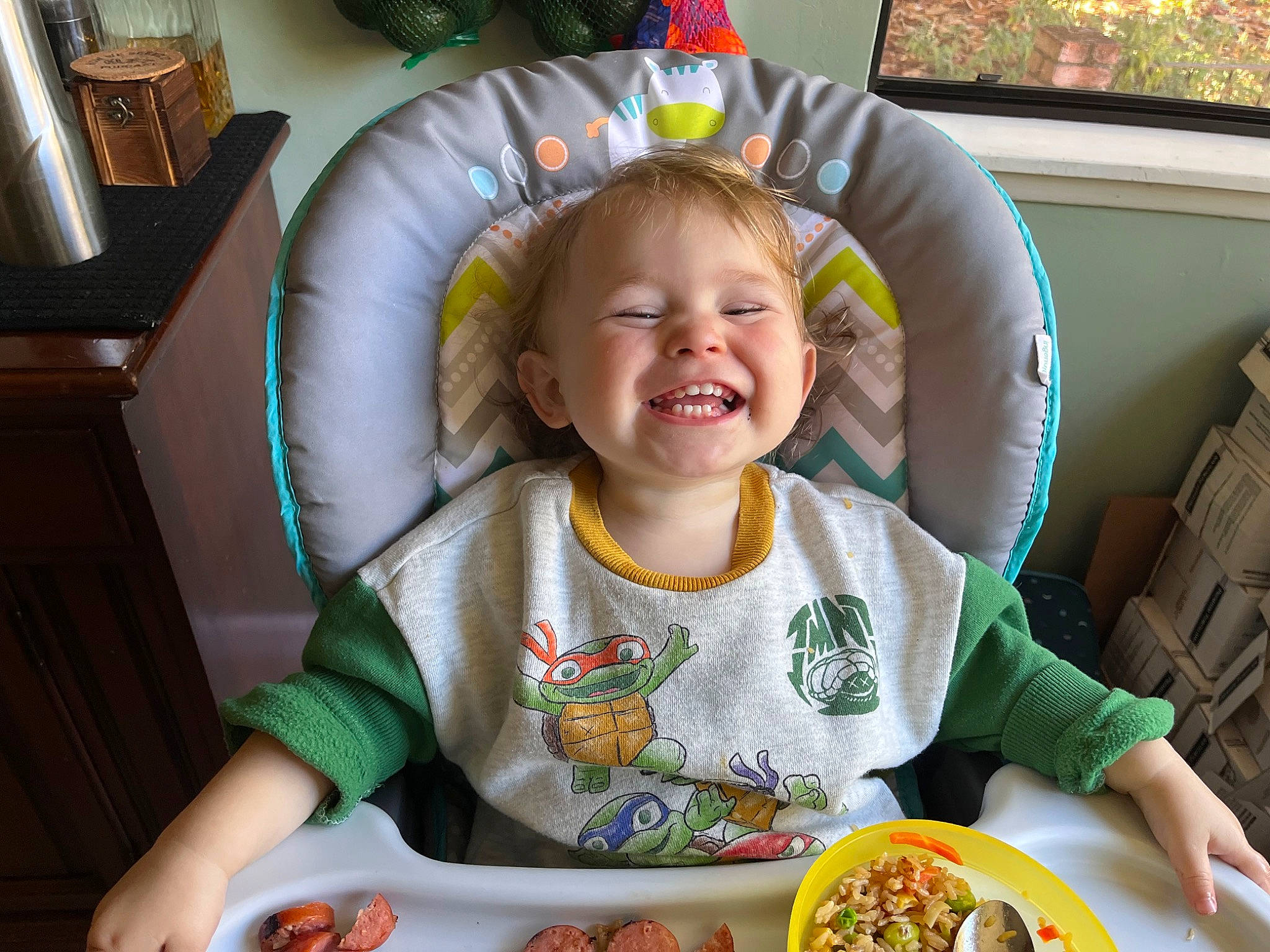Kiara is registered to the contest to win money with this photo: baby, baby_playing_with_food, baby_toddler_clothing, chair, child, comfort, comfort_food, cuisine, dish, dishware, food, food_craving, happy, joy, person, recipe, sharing, sitting, smile, table