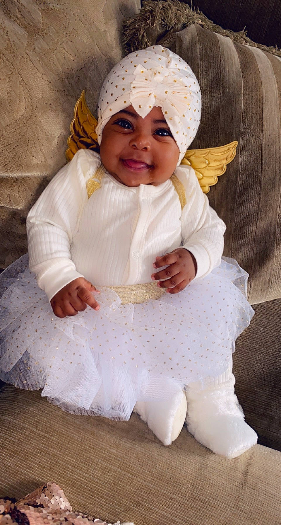 Kash Ali is registered to the contest to win money with this photo: baby, child, costume, headgear, headwear, joy, person, skin, smile, toddler, white