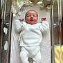 newborn, baby, sleeping, white_clothing, knitwear, hospital_bassinet, plush_toy, teddy_bear, blanket, infant, peaceful, cute, indoor, child, soft_toys, portrait, resting, newborn_baby, baby_clothes, human