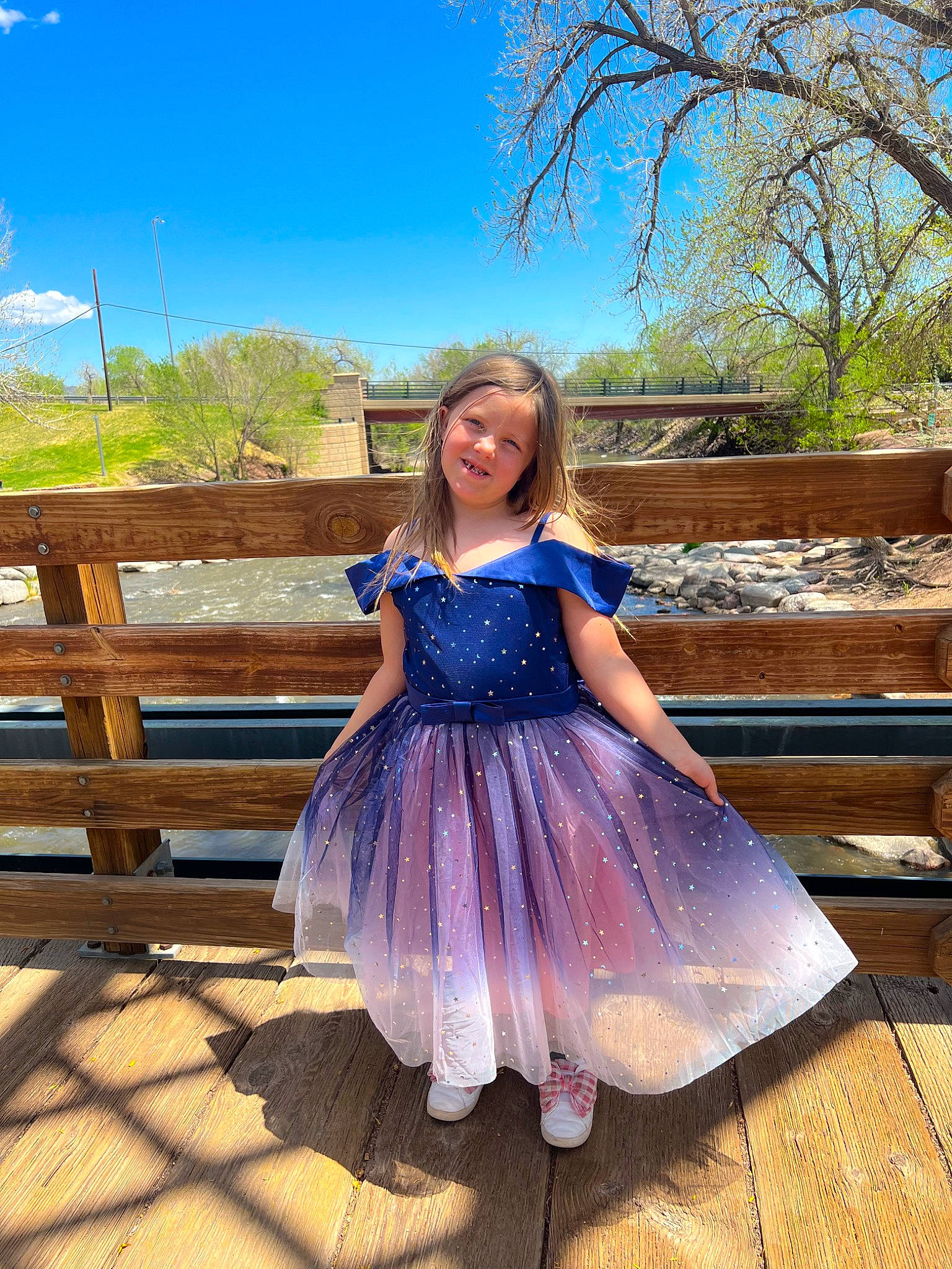 Luna is registered to the contest to win money with this photo: azure, day_dress, dress, electric_blue, flash_photography, formal_wear, fun, grass, happy, joy, landscape, leisure, magenta, person, plant, sky, smile, summer, toddler, tree