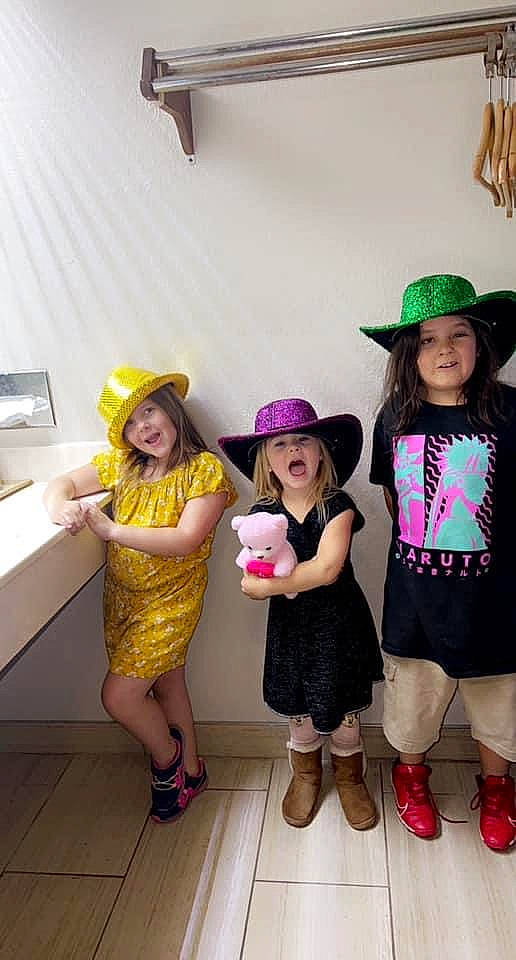 Laynie-lou is registered to the contest to win money with this photo: boot, costume_hat, event, fashion_design, fun, happy, hat, headgear, headwear, joy, leg, leisure, magenta, person, pink, purple, sandal, shoe, shorts, smile
