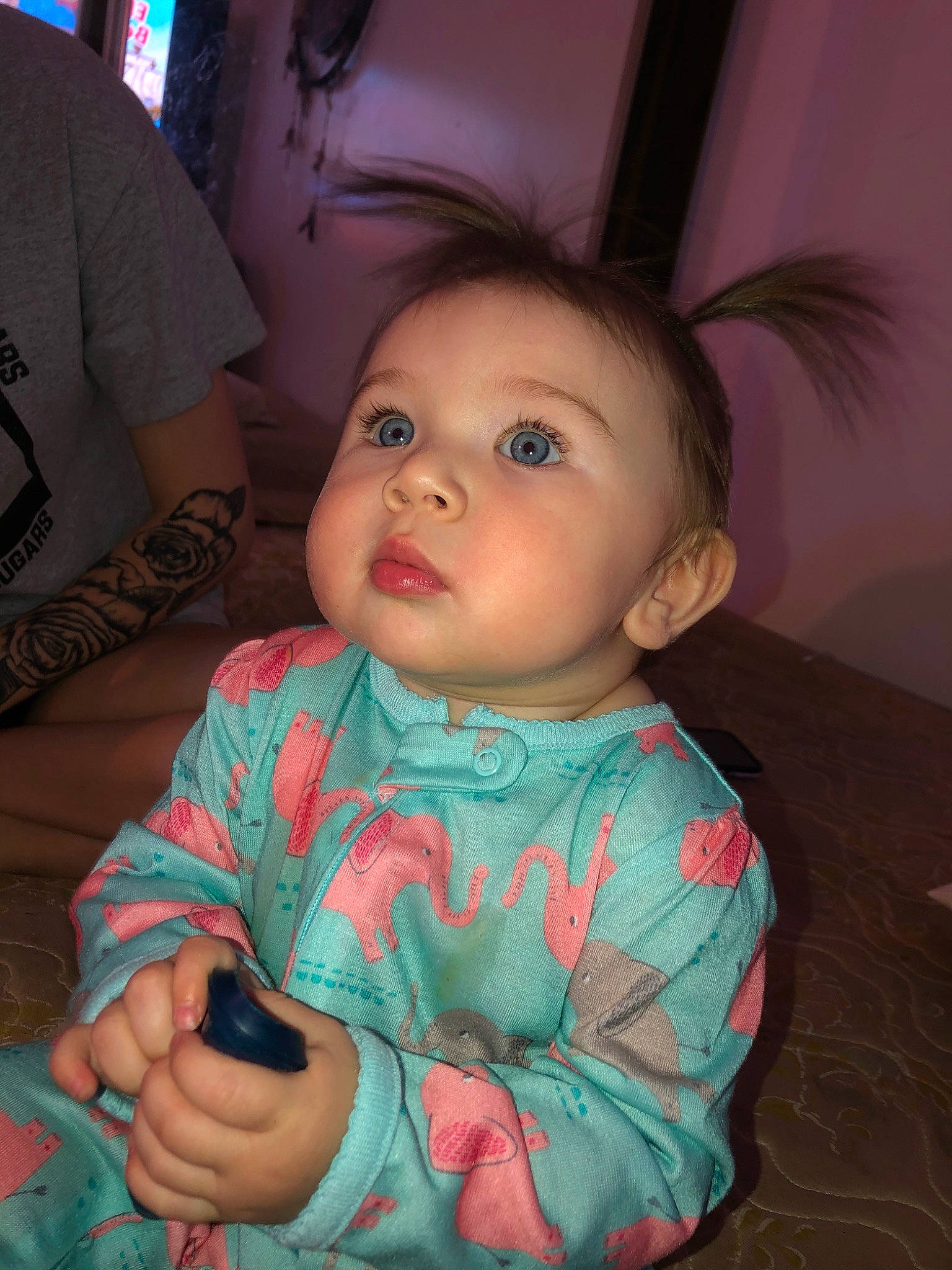 Briar is registered to the contest to win money with this photo: baby, cheek, child, chin, eye, face, forehead, head, iris, lip, mouth, nose, person, pink, sitting, skin, smile, toddler