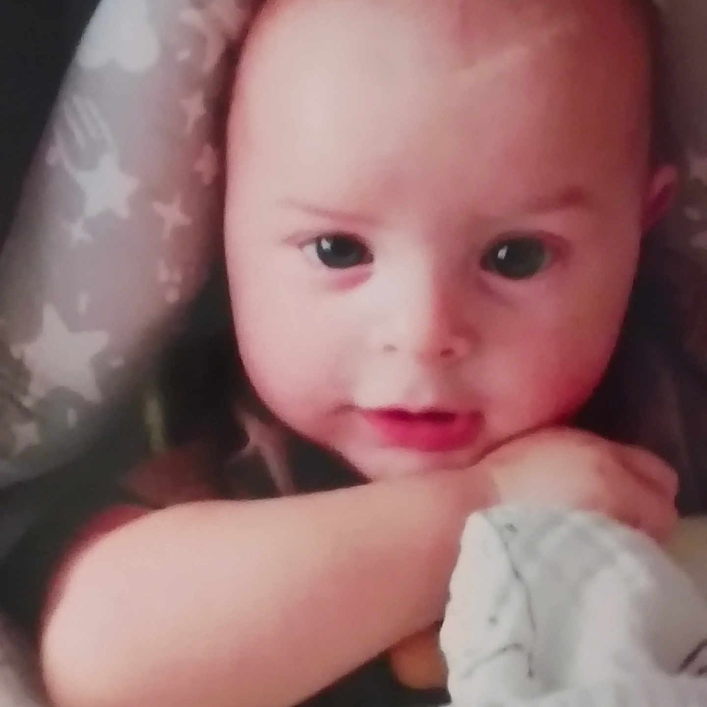 Bentley is registered to the contest to win money with this photo: baby, blanket, child, closeup, clothing, comfort, cushion, cute, expression, face, hands, head, indoor, infant, portrait, resting, seat, skin, soft_toys, young