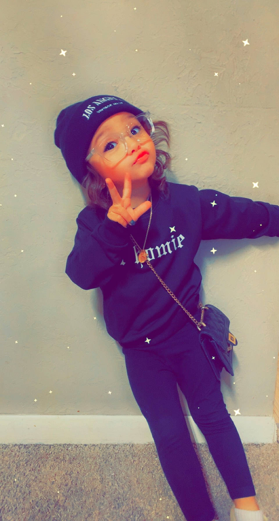 Ocean is registered to the contest to win money with this photo: cap, cool, denim, electric_blue, eyewear, fashion_accessory, fashion_design, fun, gesture, happy, headgear, headwear, magenta, person, personal_protective_equipment, pink, purple, sleeve, standing, textile