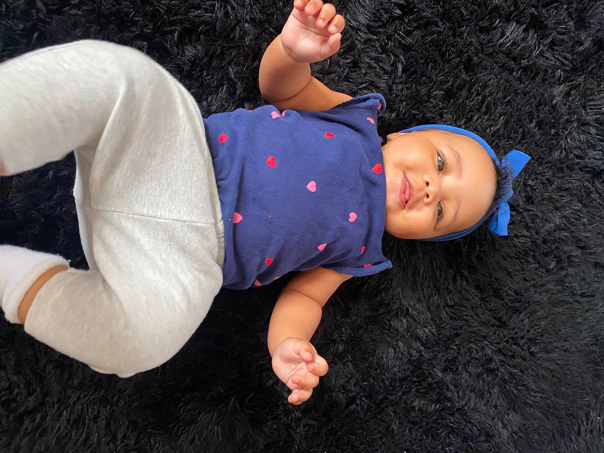 Nevaeh is registered to the contest to win money with this photo: child, denim, elbow, electric_blue, finger, flash_photography, fun, gesture, grass, hand, happy, hat, human_leg, knee, leisure, person, plant, t_shirt, thigh, toddler