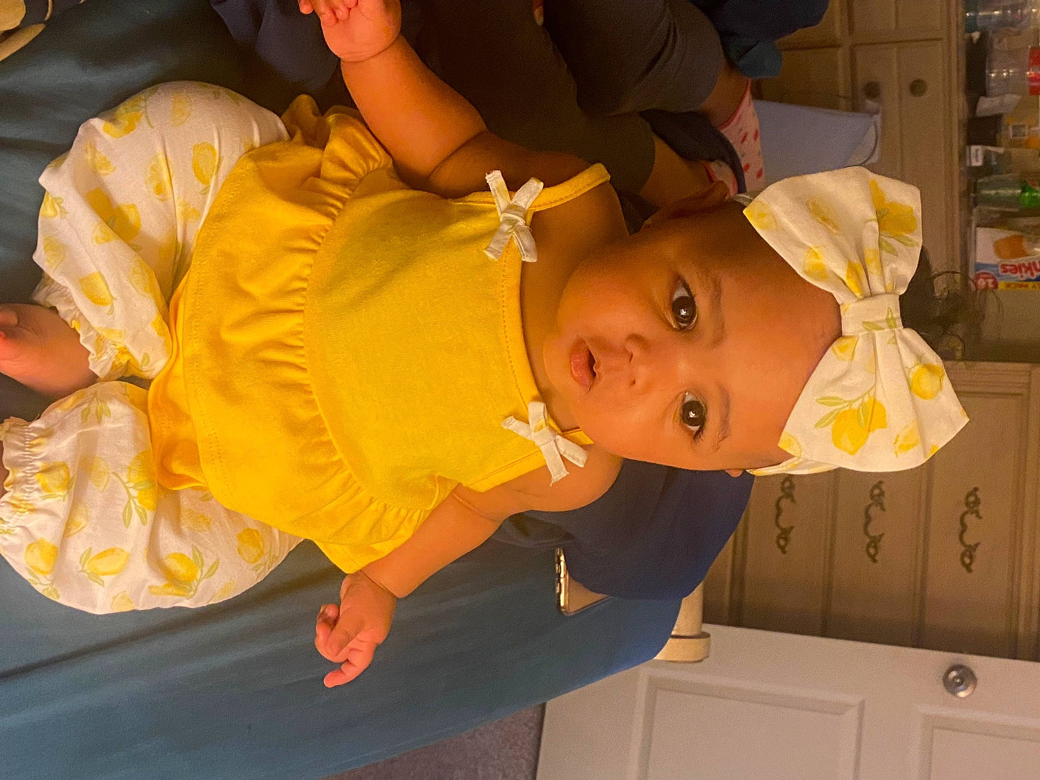 Nevaeh is registered to the contest to win money with this photo: baby, baby_products, cabinetry, child, costume, cupboard, drawer, event, eye, facial_expression, fun, happy, hat, headwear, orange, person, room, shelf, toddler