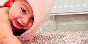 Alin joined the competition — help win amazing prizes! baby, child, pink_towel, carpet, crawling, smile, happy, face, hand, indoor, cute, skin, head, infant, young, towel, floor, portrait, playful, warm