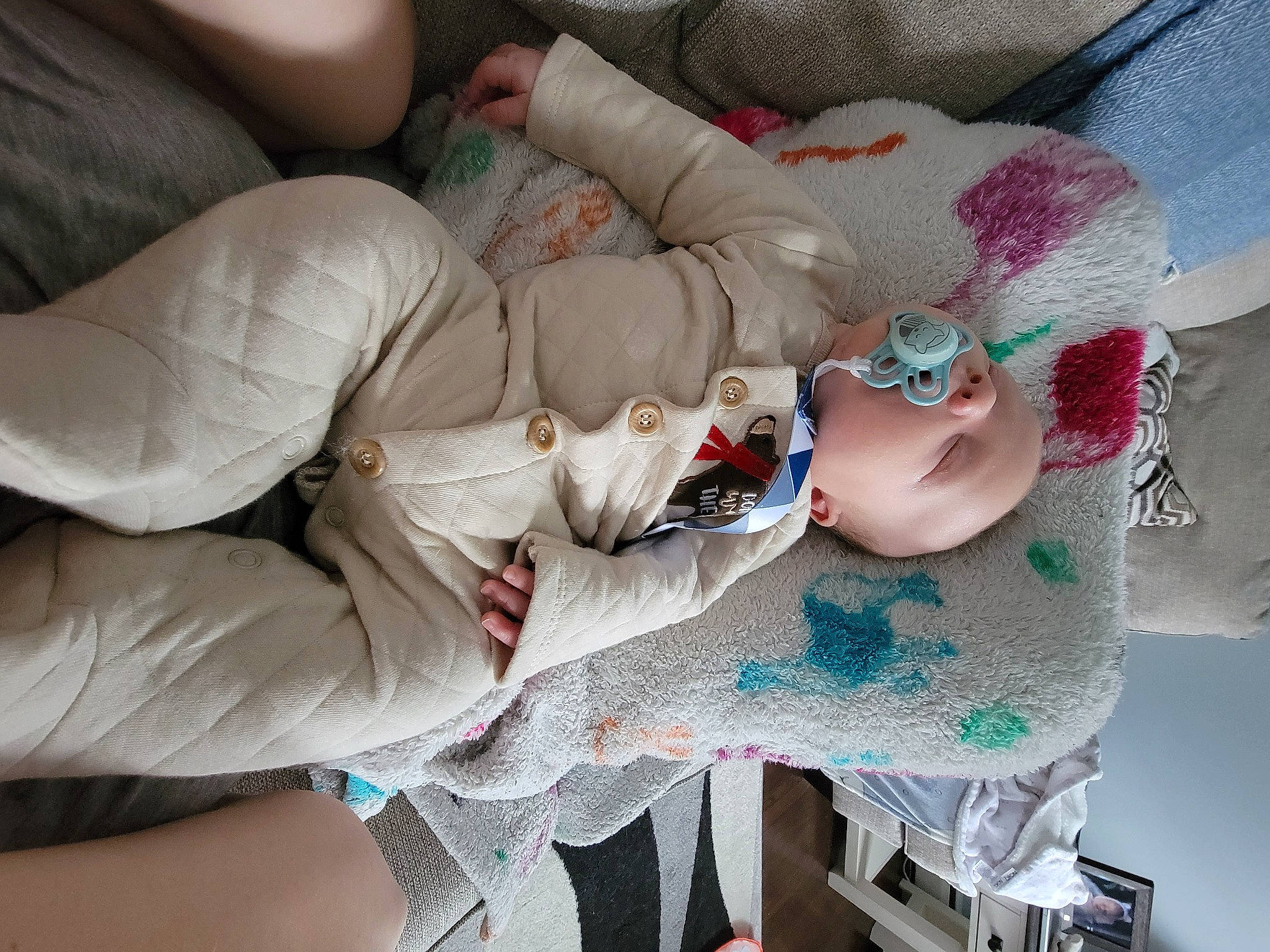 Chase is registered to the contest to win money with this photo: abdomen, arm, baby, baby_products, chest, child, comfort, elbow, event, finger, flesh, human_leg, linens, nail, pattern, person, plastic, room, sunglasses, thigh