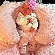 Sawyer is registered to the contest to win money with this photo: baby, child, infant, smiling, happy, portrait, flower_headband, pink_blanket, plush_blanket, cozy, lying_down, baby_clothing, long_sleeves, tutu, pink, nursery, indoor, soft_lighting, closeup, photography