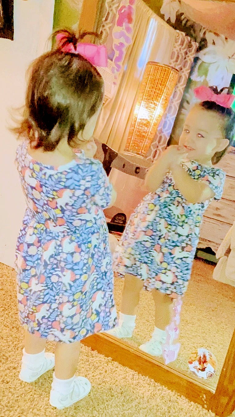 Primrose is registered to the contest to win money with this photo: baby_toddler_clothing, chair, child, day_dress, design, electric_blue, event, fashion, fashion_design, fun, hairstyle, happy, human_leg, joint, one_piece_garment, pattern, person, shoulder, sleeve, standing