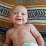 Andrew is registered to the contest to win money with this photo: baby, infant, child, smiling, happy, portrait, face, blue_eyes, bald, lying_down, diaper, blanket, striped_blanket, indoor, close_up, bare_chest, joyful, adorable, photography, candid