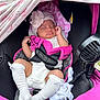 baby, sleeping, car_seat, pink, white_clothing, hat, blanket, socks, infant, child, resting, cute, comfort, safety_harness, fan, soft, relaxed, indoors, toddler, peaceful