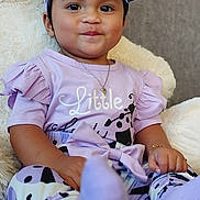 Mihiura participe au concours pour gagner de l'argent avec cette photo : toddler, child, purple_clothing, headband, teddy_bear, plush_toy, smile, sitting, indoor, portrait, cute, baby, bracelet, necklace, sock, patterned_pants, happy, young_child, soft_toy, cozy