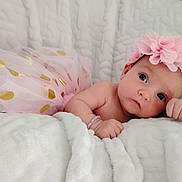 Brynlee is registered to the contest to win money with this photo: baby, infant, tutu, pink, headband, flower, blanket, soft, cute, child, portrait, indoors, resting, sleepwear, closeup, skin, hand, face, expression, adorable