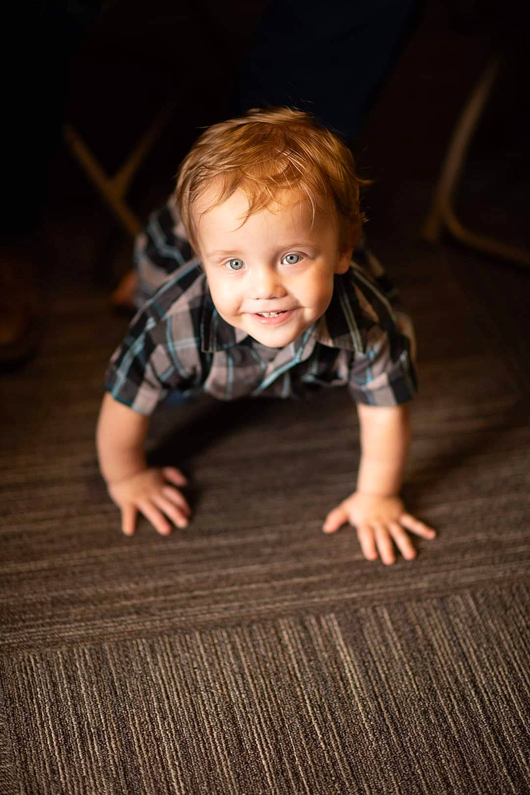 Jacoby is registered to the contest to win money with this photo: baby, baby_toddler_clothing, cheek, child, chin, crawling, darkness, eye, flash_photography, floor, flooring, fun, grass, happy, hardwood, joy, nose, person, skin, smile
