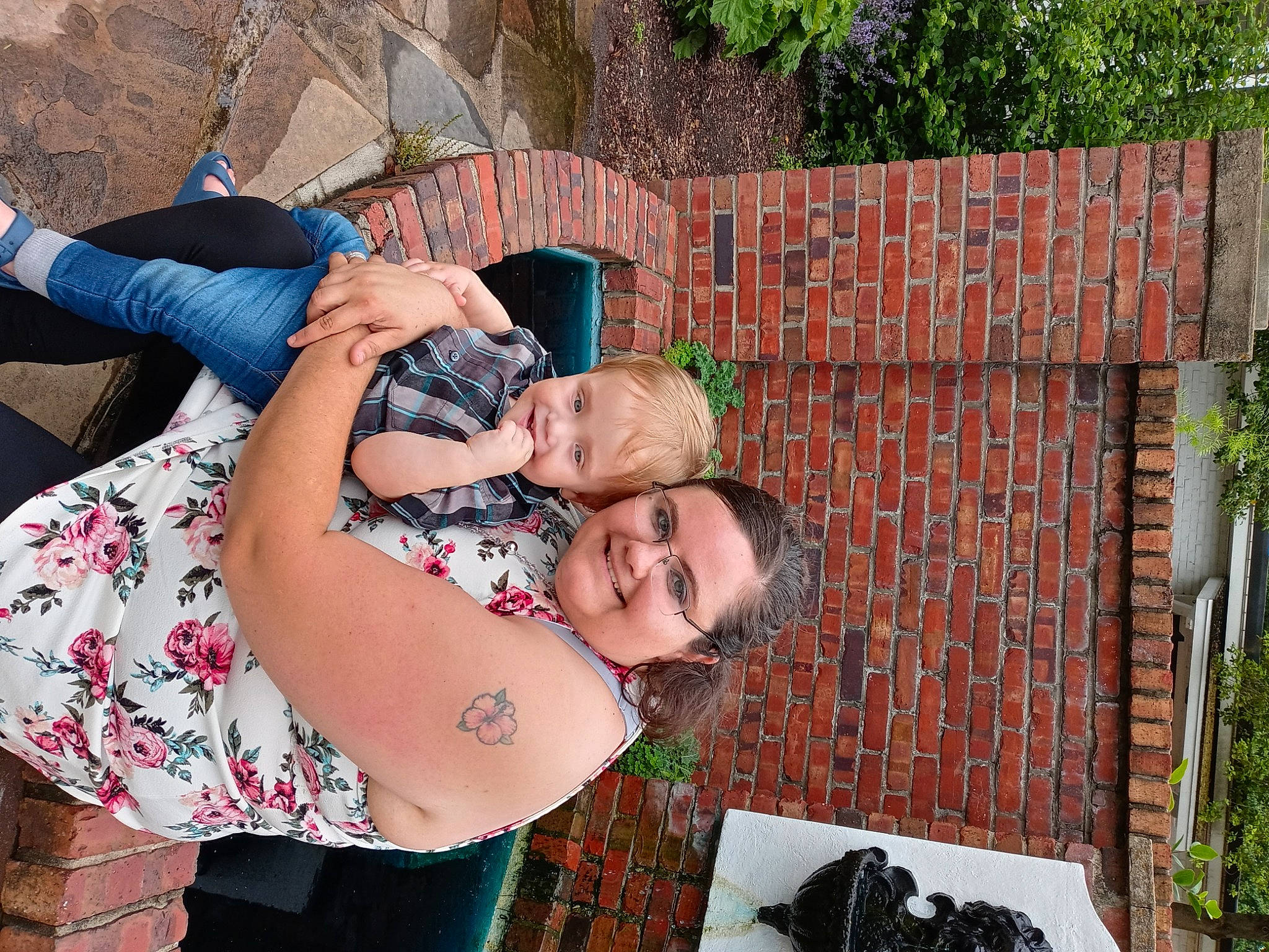 Jacoby is registered to the contest to win money with this photo: brick, brickwork, child, event, eyewear, fun, garden, gesture, glasses, grass, happy, joy, leisure, pattern, people_in_nature, person, photograph, plant, recreation, smile