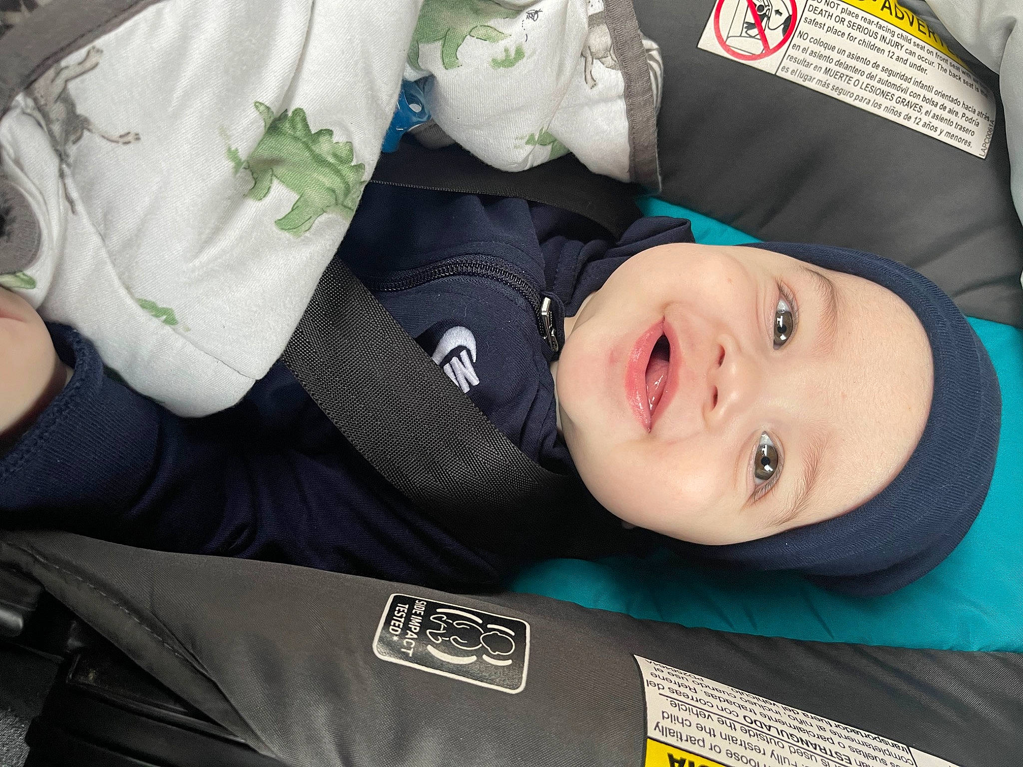 Anakin joined the competition — help win amazing prizes! auto_part, baby_products, baby_toddler_clothing, carmine, child, comfort, electric_blue, eye, fashion_accessory, happy, hat, headwear, person, portrait_photography, product, sleeve, smile, toddler, travel