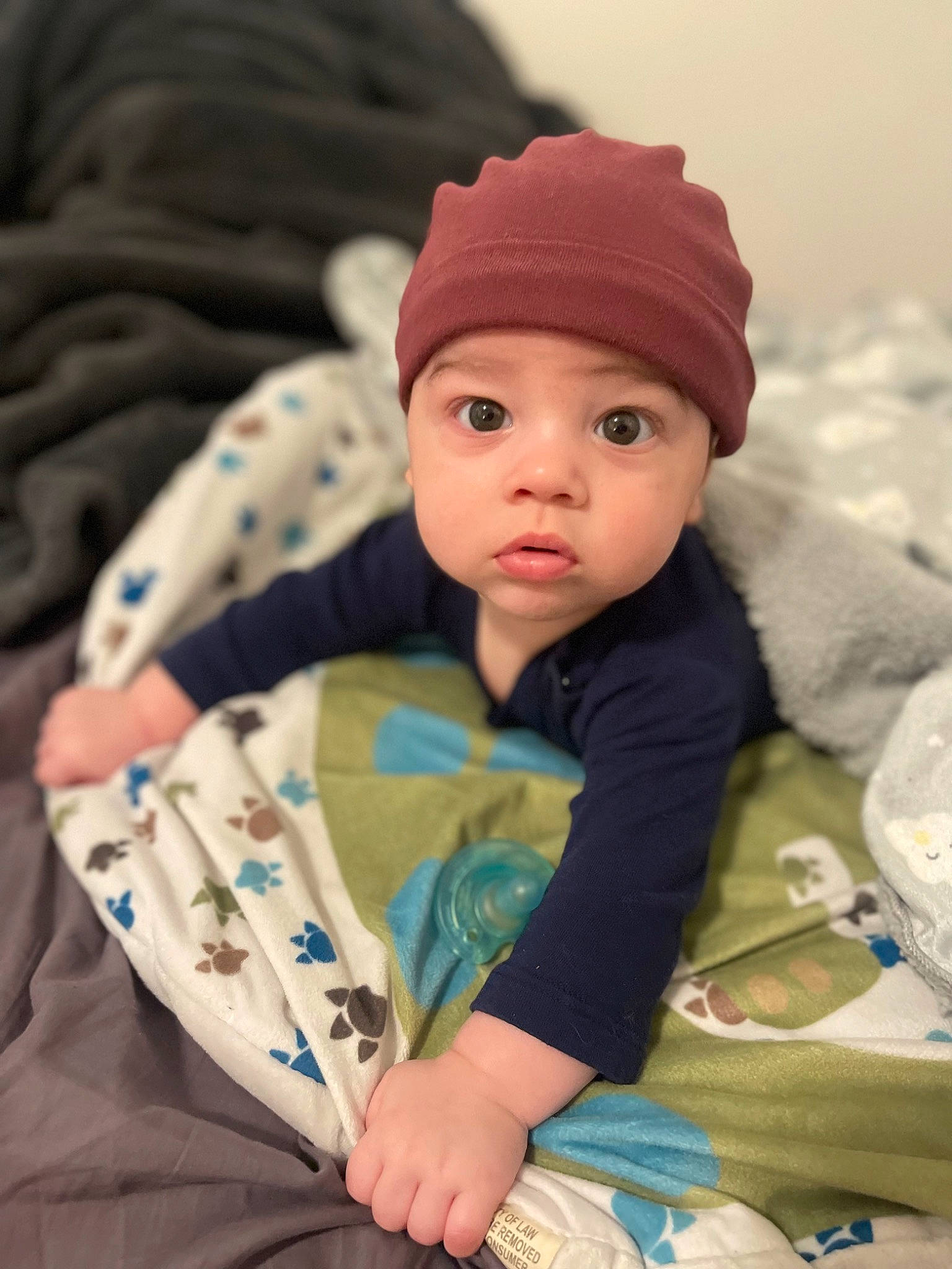 Anakin joined the competition — help win amazing prizes! baby, baby_toddler_clothing, beanie, cap, cheek, child, comfort, eye, facial_expression, fashion_accessory, head, headwear, human_body, knit_cap, linens, pattern, person, skin, sleeve, textile