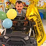 Javier joined the competition — help win amazing prizes! baby, balloon, birthday, black_toy_car, blue_balloon, yellow_balloon, gold_balloon, child, happy, indoor, party, smile, toy, winnie_the_pooh, decorations, first_birthday, festive, colorful, celebration, number_1