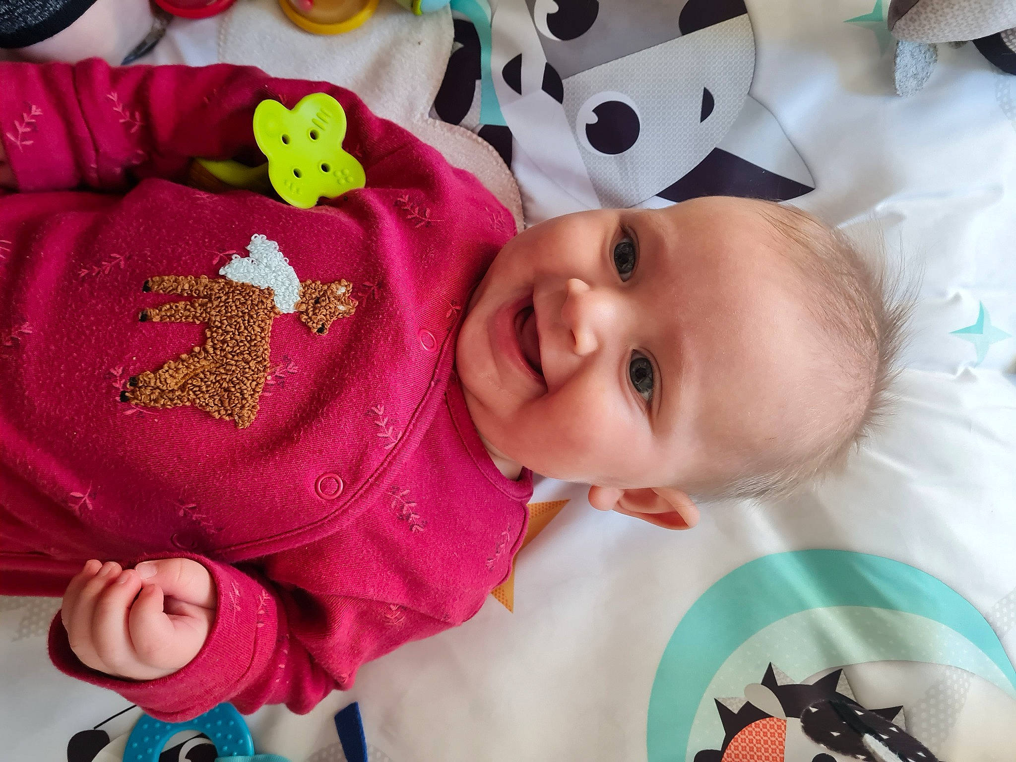Antonia is registered to the contest to win money with this photo: baby, baby_toddler_clothing, cheek, eye, face, facial_expression, green, happy, head, headgear, joy, lip, nose, organ, person, pink, product, skin, sleeve, smile