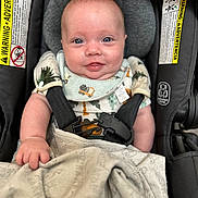 Jesiah joined the competition — help win amazing prizes! baby, infant, car_seat, blanket, smile, blue_eyes, clothing, straps, safety, cute, face, hand, head, child, indoors, fabric, comfort, young, portrait, closeup