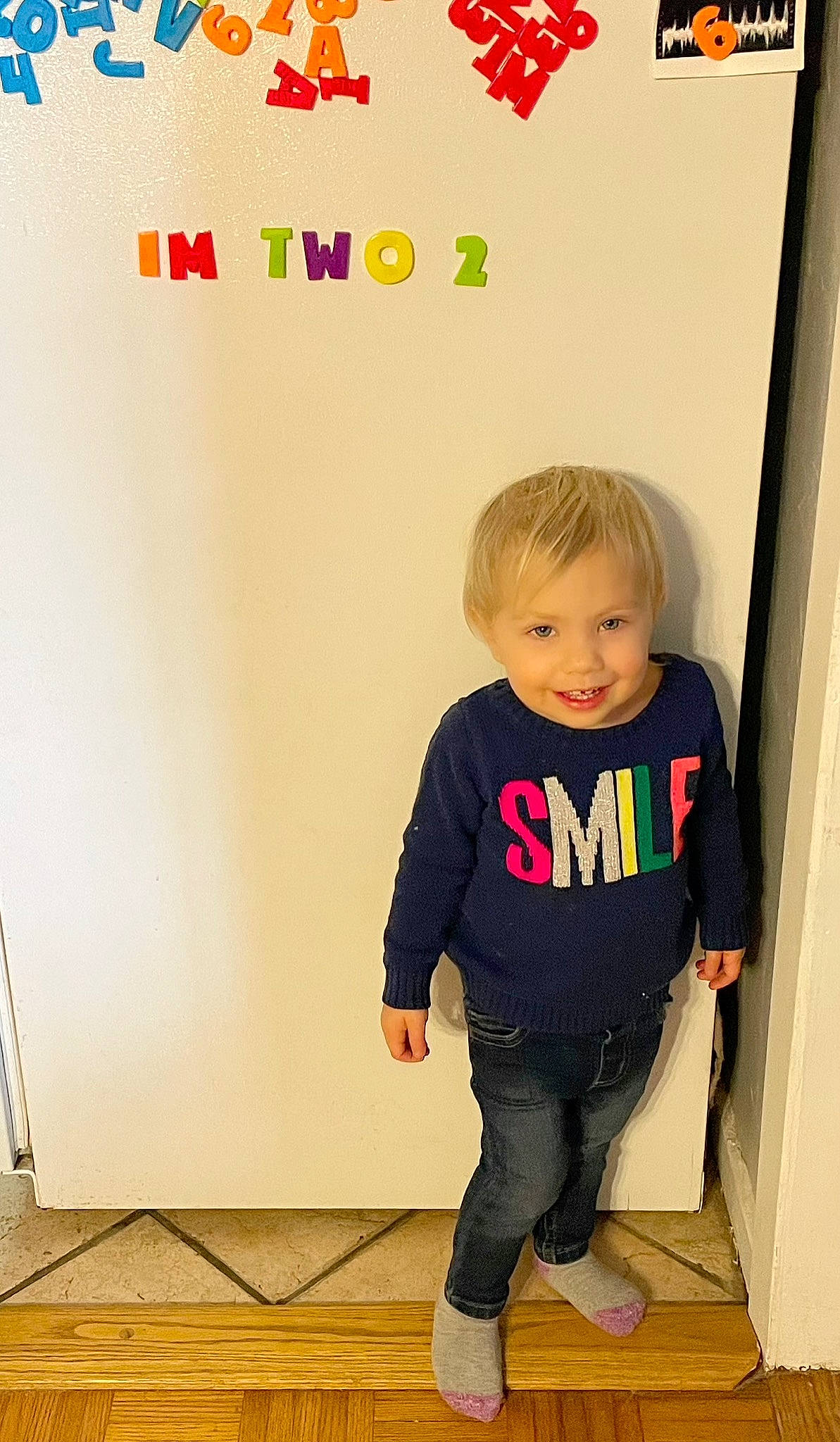 Oakleigh is registered to the contest to win money with this photo: baby_toddler_clothing, child, denim, electric_blue, facial_expression, floor, flooring, font, fun, hairstyle, happy, joint, joy, knee, neck, pattern, person, room, sleeve, t_shirt