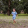 child, toddler, boy, outdoor, park, walking, denim, shirt, shorts, boots, fashion, portrait, nature, trees, grass, lawn, forest, daylight, full_body, childhood