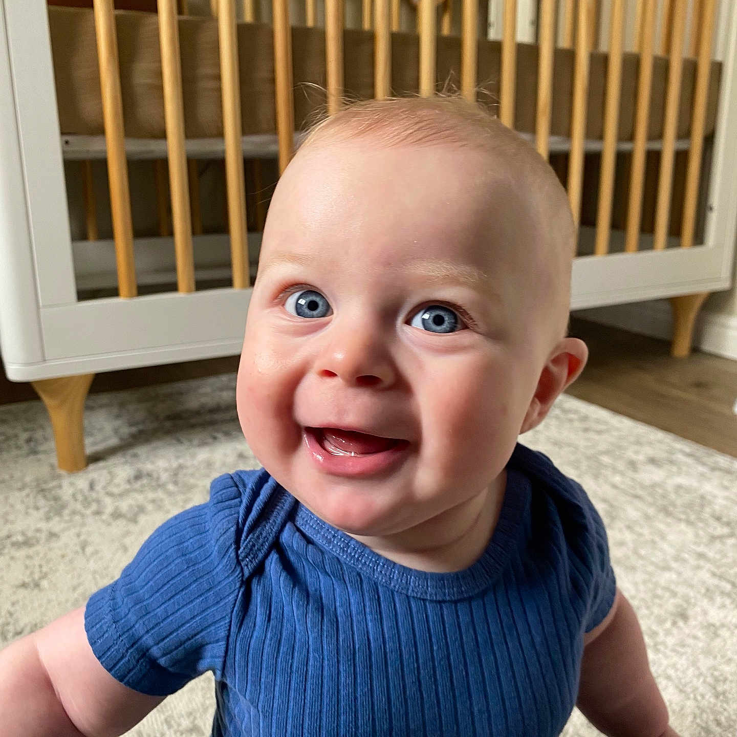 Stetson is registered to the contest to win money with this photo: baby, babylaughing, clothing, crib, dress, face, furniture, happy, head, indoors, infantbed, jeans, laughing, pants, person, photography, portrait, sitting, sleeve, smile
