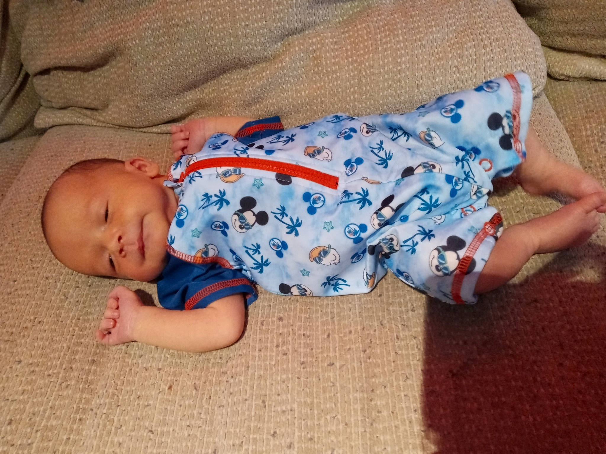 Axel is registered to the contest to win money with this photo: baby, baby_products, baby_sleeping, baby_toddler_clothing, bedtime, child, comfort, electric_blue, flooring, grass, human_leg, linens, nap, pattern, person, sitting, sleep, sleeve, sock, toddler