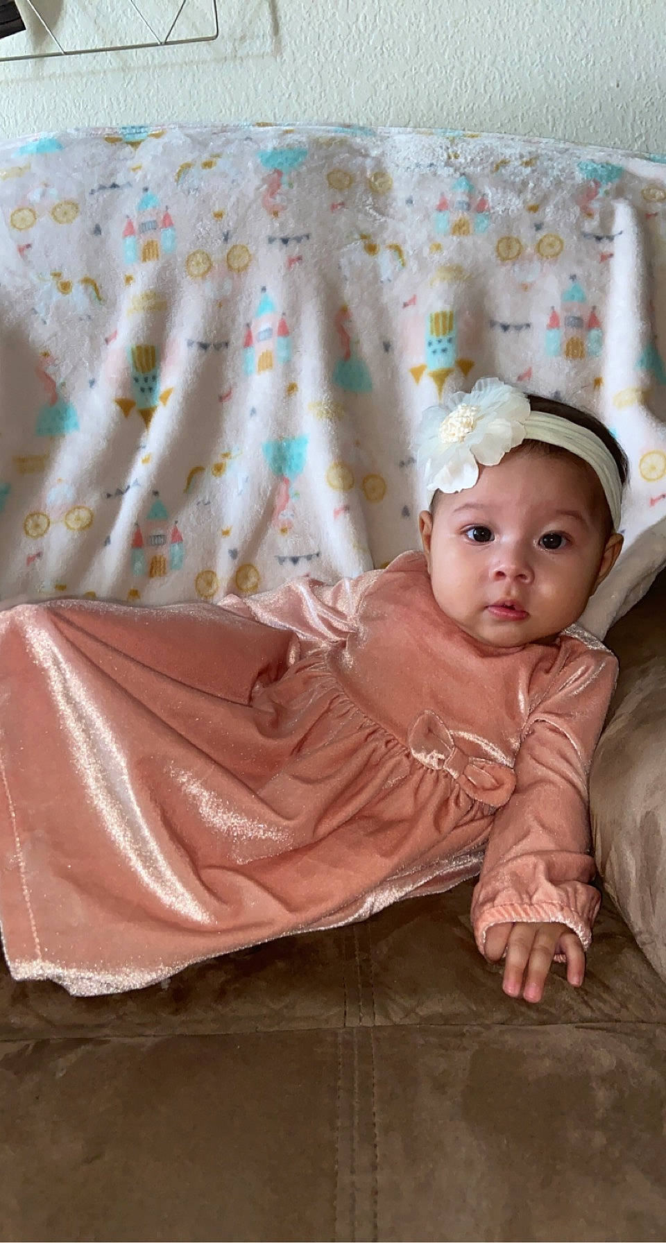 Saraí joined the competition — help win amazing prizes! baby, baby_toddler_clothing, child, comfort, eye, flash_photography, flooring, fur, headwear, linens, magenta, pattern, peach, person, pink, room, sitting, skin, sleeve, textile