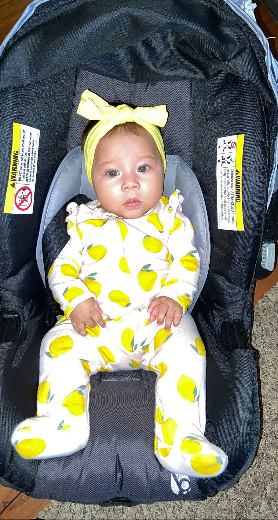 Saraí is registered to the contest to win money with this photo: baby, baby_carriage, baby_products, baby_safety, baby_toddler_clothing, bag, bib, cheek, child, comfort, linens, outerwear, pattern, person, personal_protective_equipment, product, sitting, sleeve, toddler, white