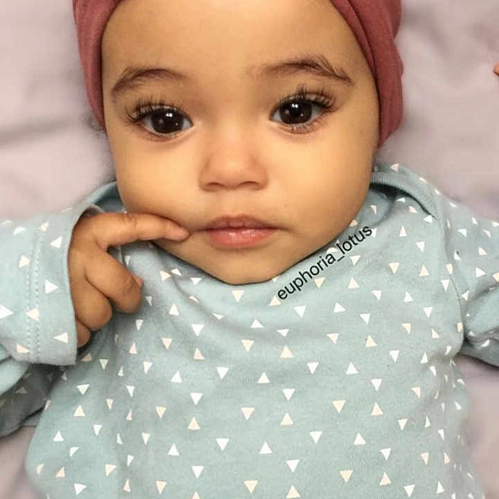 Anika is registered to the contest to win money with this photo: baby, cheek, child, design, ear, eye, eyebrow, eyelash, face, forehead, head, headgear, lip, pattern, person, pink, polka_dot, skin, smile, toddler