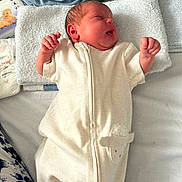 Hazel joined the competition — help win amazing prizes! newborn, baby, sleeping, onesie, white_towel, blanket, diaper, bed, infant, clothing, cute, peaceful, soft, face, hand, foot, portrait, indoors, resting, child