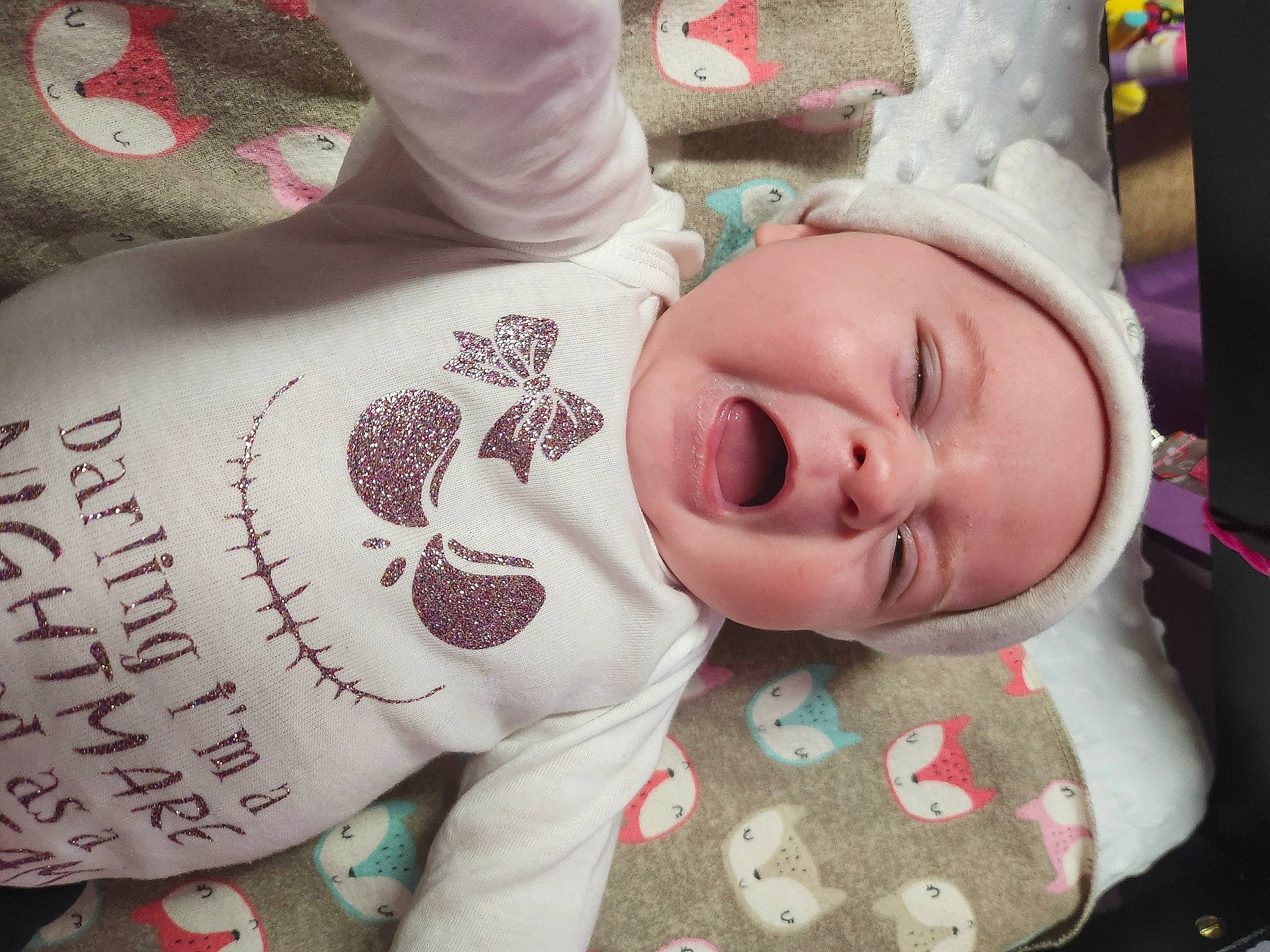 Gwendolynn is registered to the contest to win money with this photo: baby, cheek, comfort, cool, eye, eyelash, finger, head, headwear, lip, mammal, mouth, neck, nose, person, pink, product, skin, sleeve, smile