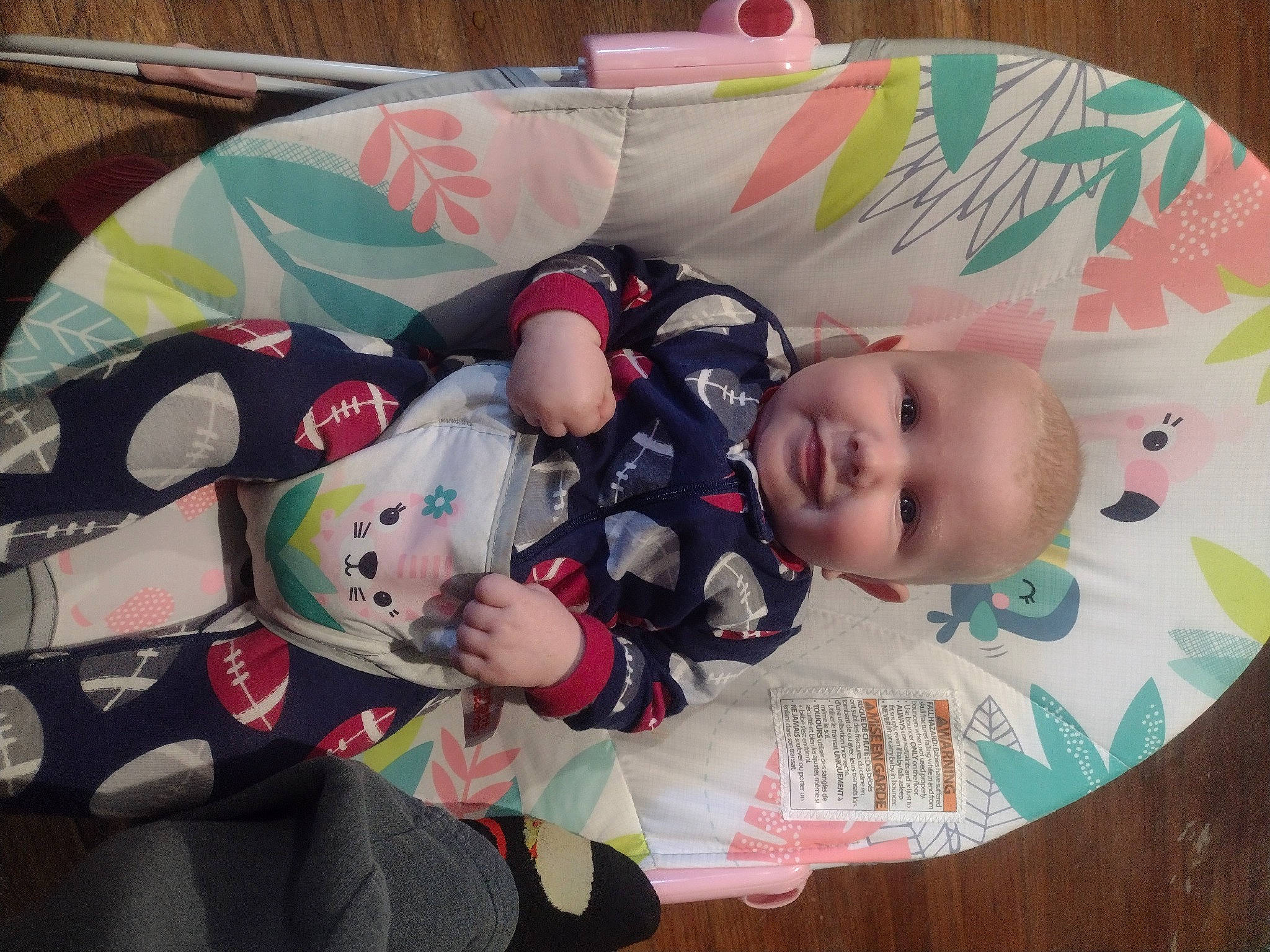 Jordan is registered to the contest to win money with this photo: baby, baby_carriage, baby_products, baby_toddler_clothing, child, comfort, joy, lap, linens, pattern, person, room, sitting, sleeve, toddler, tree
