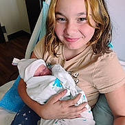 Alleah is registered to the contest to win money with this photo: child, newborn, baby, hospital, blanket, bed, pillow, smile, girl, person, indoor, holding, family, love, clothing, face, happy, human, caring, toddler