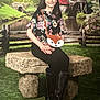 Lindsay is registered to the contest to win money with this photo: child, girl, bench, stone, floral_top, black_boots, fox_purse, long_hair, smile, outdoor_background, watermill, river, wooden_fence, greenery, flowers, grass, portrait, sitting, nature, scenic