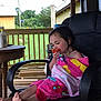 child, towel, chair, porch, outdoor, vegetable, tomato, eating, barefoot, wooden, furniture, relaxed, summer, greenery, house, satellite_dish, casual, daylight, person, seated