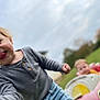 Morgan joined the competition — help win amazing prizes! child, toddler, smiling, tongue_out, toy_car, outdoor, grass, sky, play, happy, cute, blond_hair, casual_clothing, fun, daytime, nature, person, portrait, blurred_background, park